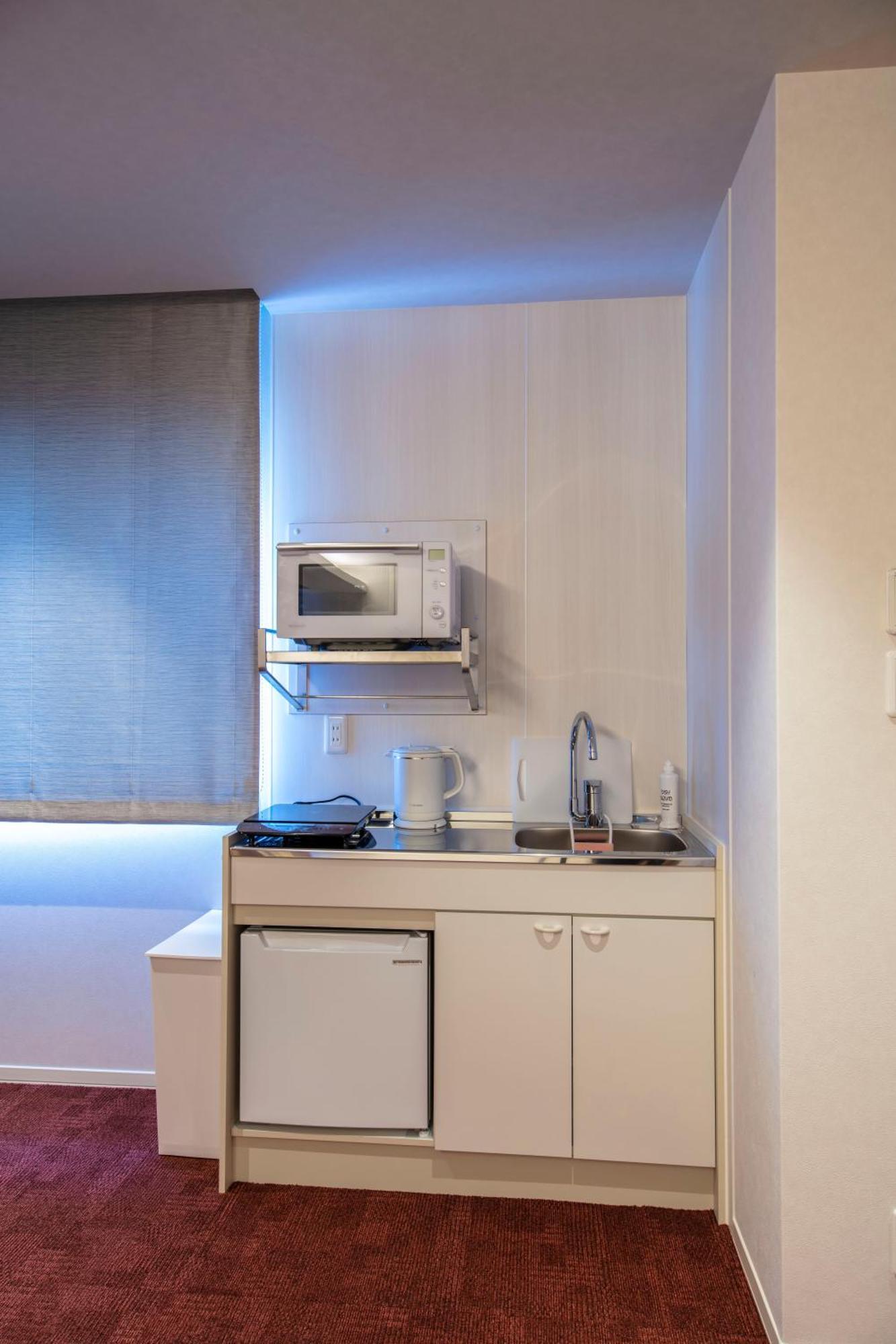 Grand Base Okayama Ekimae Aparthotel Eksteriør bilde